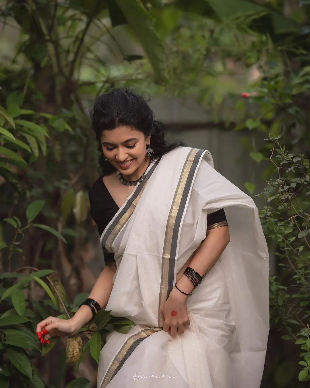 Malayalam Actress Anju Kurian Stills in White Saree Black Blouse